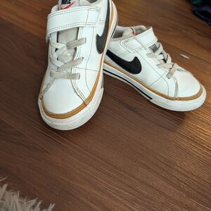 Nike Kids White Sneakers with Black Swoosh and Tan Trim